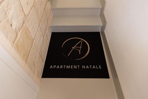 a sign for an apartmentmart market on a wall at Apartment Natale 2 in Monopoli