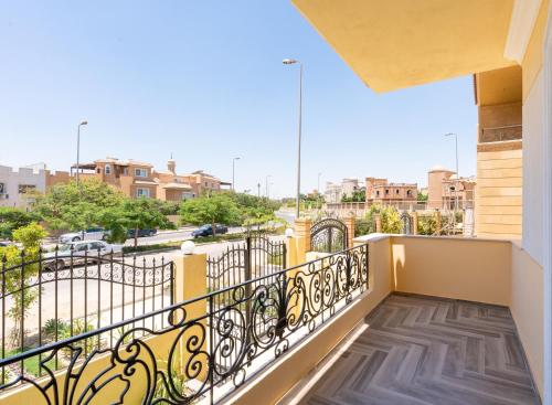 a balcony with a view of a street at BIRD NEST Near Arkan Plaza in Cairo