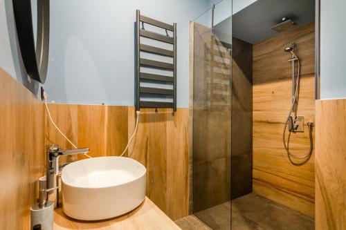 a bathroom with a sink and a shower at Viral 2 BR Photo Studio Loft in Sofia