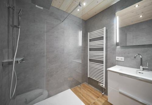 a bathroom with a shower and a sink at Schima Drosa Apartments - Studios - by Pferd auf Wolke in Gaschurn