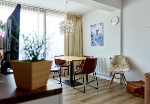 a dining room with a table and chairs at Schima Drosa Apartments - Studios - by Pferd auf Wolke in Gaschurn