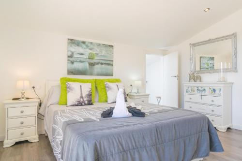 a bedroom with a large bed and two night stands at Finca Miralles in Búger