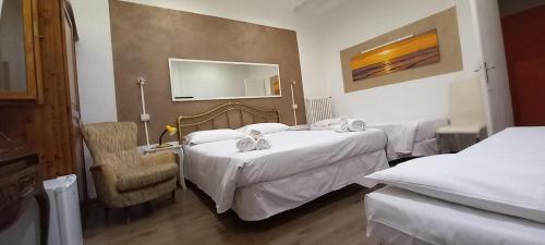מיטה או מיטות בחדר ב-Il Viale