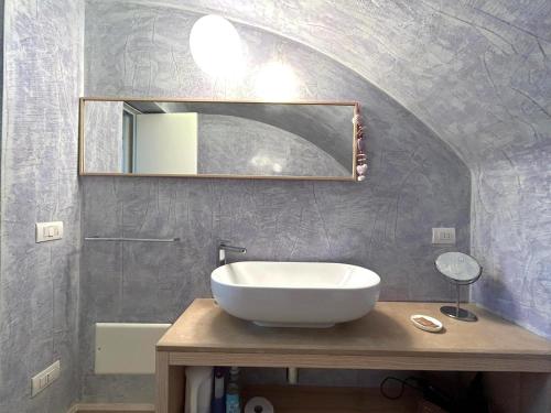 a bathroom with a sink and a mirror at Villa Romasi in Leuca
