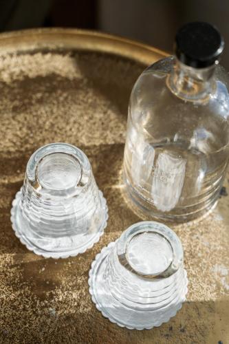 two glass jars sitting on top of a table at Fritiden Hotell & Kongress in Ystad