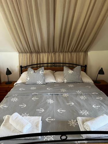 Posteľ alebo postele v izbe v ubytovaní Szőlőskert Studio Apartman Ábrahámhegy