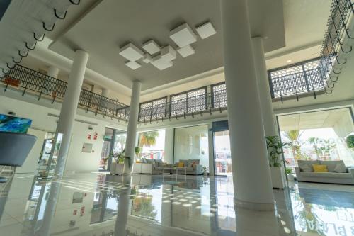 a lobby of a building with columns and ceilings at Dos Playas - 30º hotels in Puerto de Mazarrón