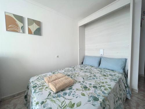 a bedroom with a bed with a pillow on it at Ocean Views - Beach Apartment in Patalavaca