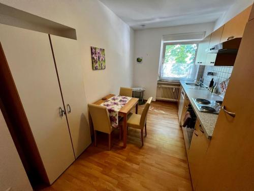 a kitchen with a table and a table and chairs at Wohnung in bester Lage von Witten in Witten