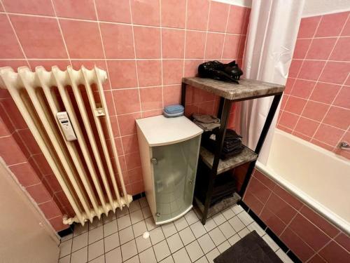 a bathroom with a heater and a toilet in a bathroom at Wohnung in bester Lage von Witten in Witten