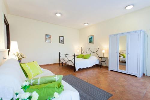 a large room with two beds and a mirror at Apartments Garden in Motovun