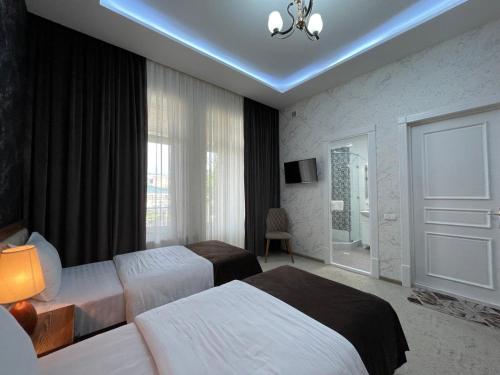 Кровать или кровати в номере Sabrina Hotel