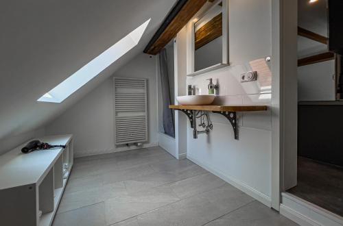 a bathroom with a sink and a mirror at Hotel Hohlebach Mühle in Homberg