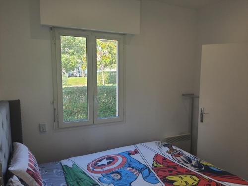 Ένα ή περισσότερα κρεβάτια σε δωμάτιο στο Maison sympa à 3 minutes de disneyland