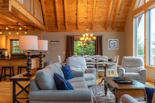 a living room with a couch and a table at Mayapple Ridge in Sugar Grove