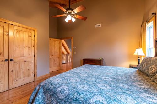 a bedroom with a bed and a ceiling fan at Mayapple Ridge in Sugar Grove
