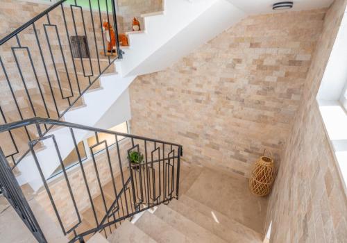 an image of a staircase with a brick wall at Twins Apartment in Ulcinj
