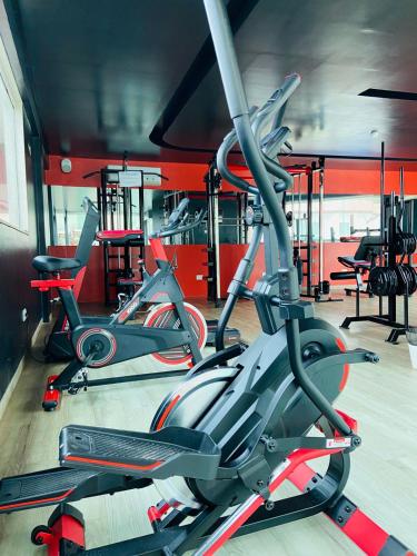 a gym with three exercise bikes in a room at Reserve Hotel in Surubim