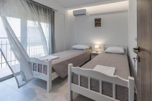 Postel nebo postele na pokoji v ubytování Diorisa House