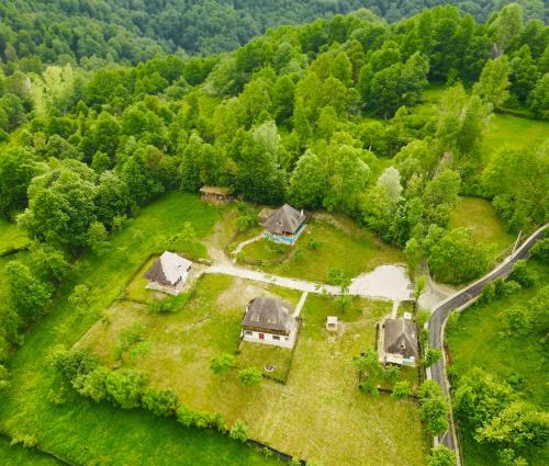 an aerial view of a house in the middle of a field at Inside, The Village- Atelier 