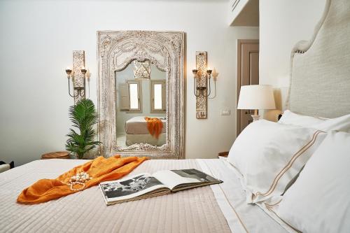 Ένα ή περισσότερα κρεβάτια σε δωμάτιο στο Aqua Mykonos Suites - Adults Only
