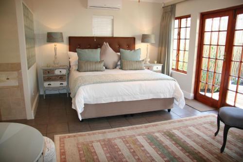 Ένα ή περισσότερα κρεβάτια σε δωμάτιο στο Cape Robin Cottage