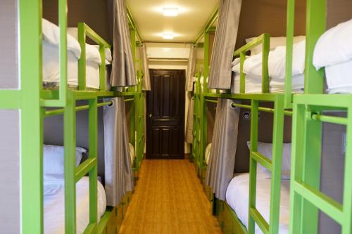 a group of bunk beds in a room at Mad Monkey Vang Vieng in Vang Vieng
