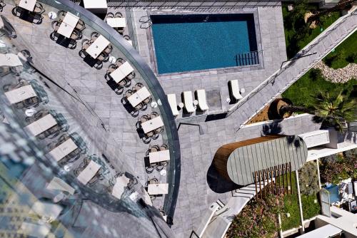 an overhead view of a parking lot with a pool at Crowne Plaza - Marseille Le Dôme in Marseille