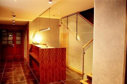 a room with a counter and stairs in a room at Hostal Rural Haizea in Espinal-Auzperri