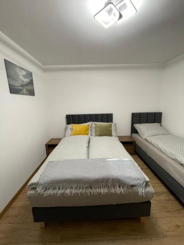 a bedroom with a bed and a couch in it at Route 7 Rooms in Myślenice
