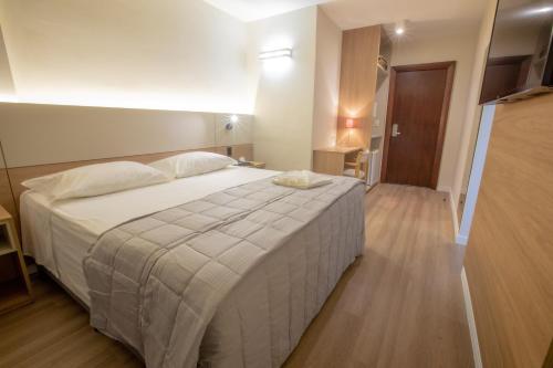 Ένα ή περισσότερα κρεβάτια σε δωμάτιο στο Antonio´s Palace Hotel