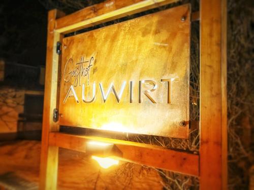 a sign that says church awnut on a wooden box at Gasthof Auwirt in Sankt Michael im Lungau