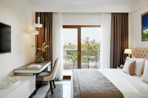 Potidea Palace Hotelにあるベッド