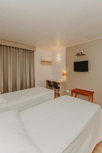 Ένα ή περισσότερα κρεβάτια σε δωμάτιο στο Antonio´s Palace Hotel