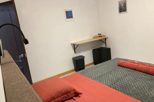 Postel nebo postele na pokoji v ubytování "Tiaré" city center room