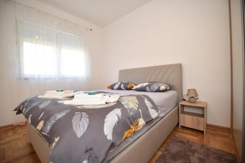 Postel nebo postele na pokoji v ubytování Apartman Balkan