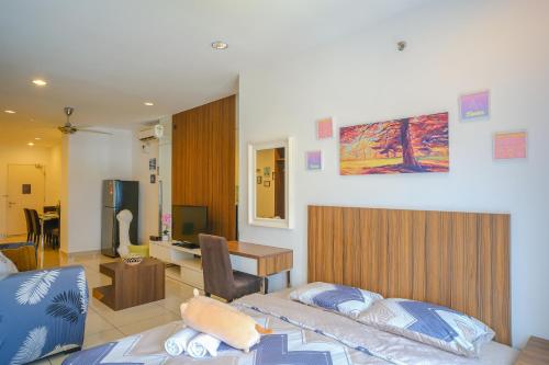 a hotel room with a bed and a desk and a room at Mansion One l 4pax Studio A l Cityview l Gleneagle l by PerfectSweetHome in George Town