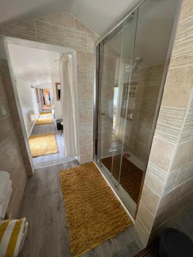 a shower with a glass door in a bathroom at Quay Central in Exeter