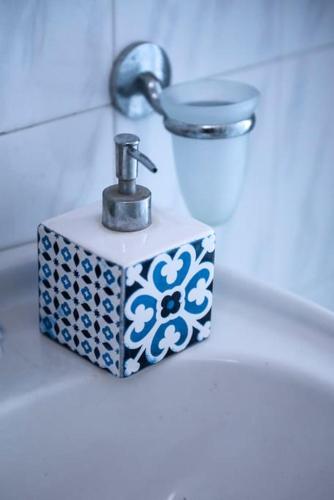 a bathroom sink with a faucet on a counter at Villa Amerita in Elia Laconias