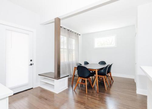 a dining room with a table and chairs at Sage House in Asheville