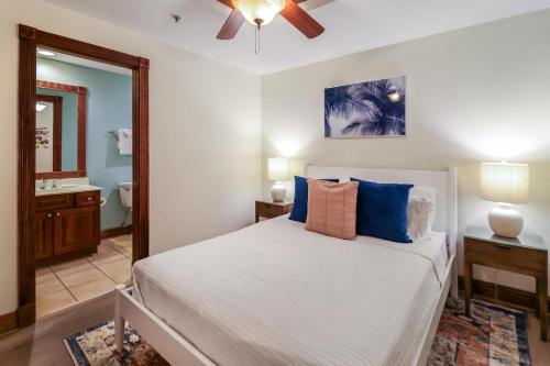 a bedroom with a bed and a ceiling fan at The Vue 233 in Tybee Island