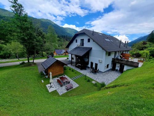 an aerial view of a house in a field at Reset Apartments in Kranjska Gora