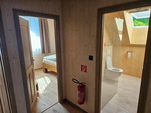 a room with a room with a fire hydrant next to a door at Chata Paja in Liptovský Mikuláš