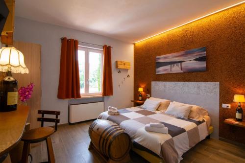 a hotel room with a bed and a table at Boutique Relais Villa Sofia in Gaiole in Chianti