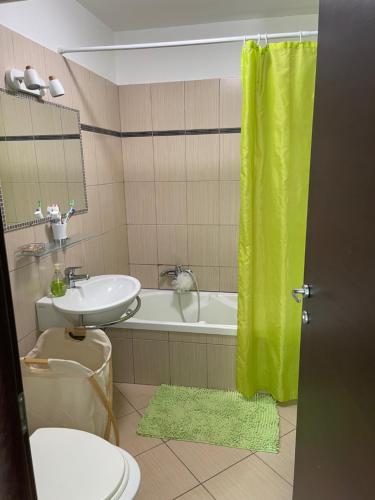 a bathroom with a sink and a toilet and a tub at Corse Balagne Les Terrasses de Lozari secteur Ile Rousse in Belgodère