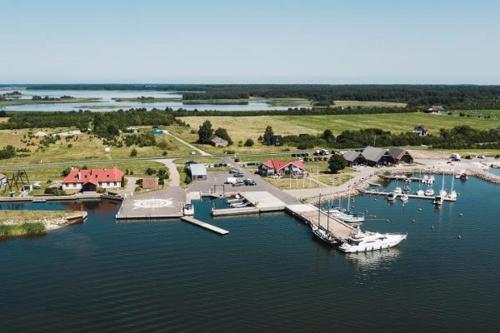 an aerial view of a marina with boats in the water at Juniper holiday house in Kassari with sauna in Hiiumaa