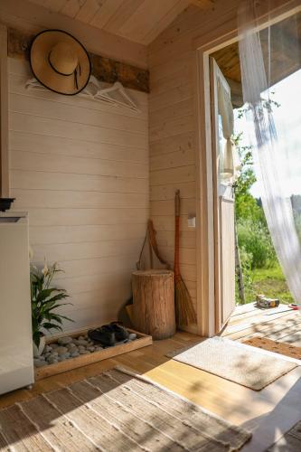 a room with a door open to a porch at Ambercoast in Jūrmala