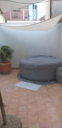 a bed sitting on the floor of a room at appartamento Claudia in Roccalumera
