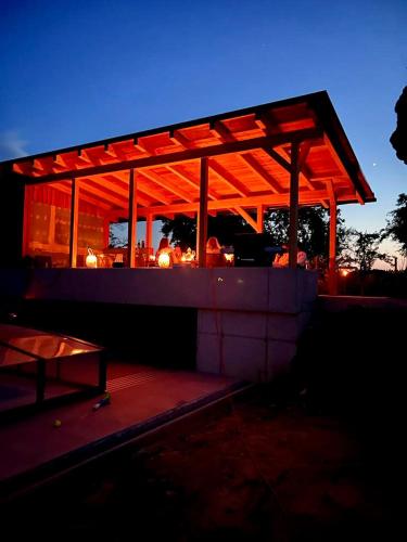 a pavilion with lights on top of it at night at Landhaus dasThomas in Henndorf 
