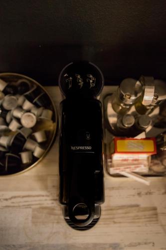 a cell phone sitting on top of a table next to a box of medicines at Vila Lio & Restaurant Devojacki Bunar in Novi Vladimirovac